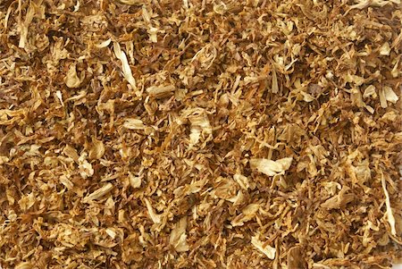 Dried light brown sliced tobacco leaves background close-up. Stock Photo - Budget Royalty-Free & Subscription, Code: 400-04445713