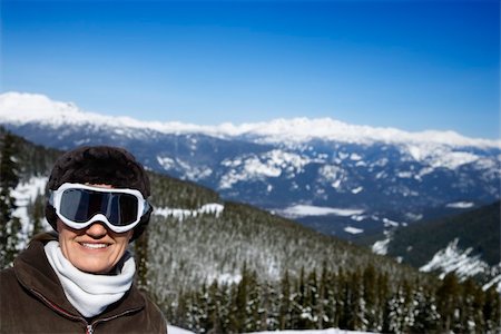 Caucasian middle-aged woman skier posing on mountain. Stock Photo - Budget Royalty-Free & Subscription, Code: 400-04446128