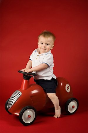 Portrait of Caucasian male child driving play car. Stock Photo - Budget Royalty-Free & Subscription, Code: 400-04446151