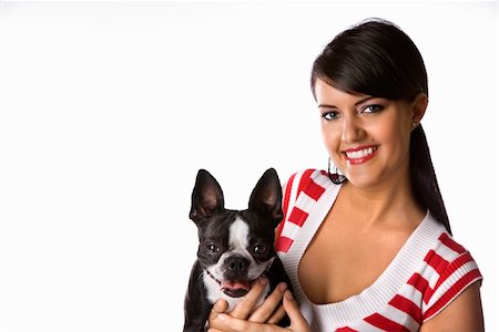 simsearch:400-04446187,k - Young adult female Caucasian holding Boston Terrier dog. Photographie de stock - Aubaine LD & Abonnement, Code: 400-04446368