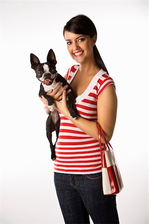 simsearch:400-04446187,k - Young adult female Caucasian holding Boston Terrier dog. Photographie de stock - Aubaine LD & Abonnement, Code: 400-04446369