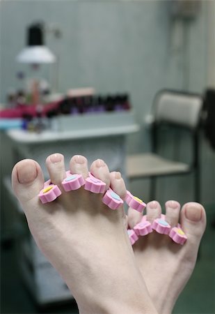 paint toe nails - Barefooted female legs in a pedicure study Stock Photo - Budget Royalty-Free & Subscription, Code: 400-04446861