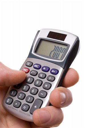hand with calculator, number 2007 on it display Foto de stock - Super Valor sin royalties y Suscripción, Código: 400-04446955