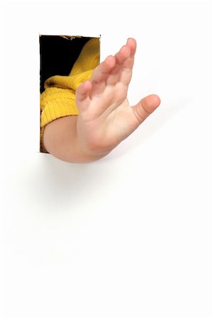 child hand through hole in white paper Foto de stock - Super Valor sin royalties y Suscripción, Código: 400-04446953