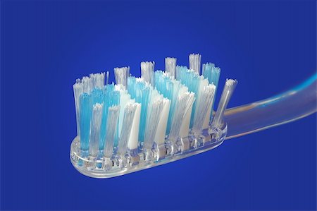 simsearch:400-04552289,k - Close up of a tooth brush over gradient blue background Foto de stock - Super Valor sin royalties y Suscripción, Código: 400-04447922