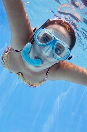 pictures of woman snorkeling underwater - Girl in bikini swimming underwater in blue pool Stock Photo - Budget Royalty-Free & Subscription, Code: 400-04447932