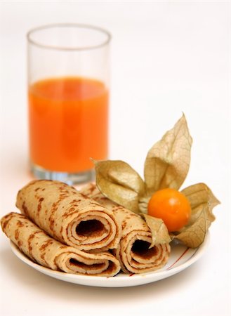 Pancakes on a plate and a glass with carrots juice Stock Photo - Budget Royalty-Free & Subscription, Code: 400-04448089