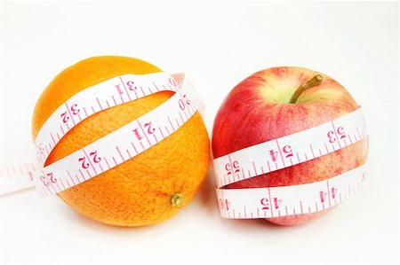 simsearch:400-03990146,k - Measurement tape wrapped around red apple and a orange - health, diet Foto de stock - Royalty-Free Super Valor e Assinatura, Número: 400-04448112