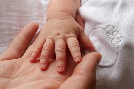 parents with sick baby - Little hand from a little baby and father. Stock Photo - Budget Royalty-Free & Subscription, Code: 400-04448140