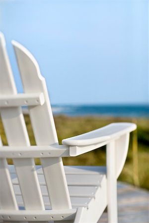 simsearch:400-03923118,k - Adirondack chairs on deck looking towards beach on Bald Head Island, North Carolina. Fotografie stock - Microstock e Abbonamento, Codice: 400-04448281