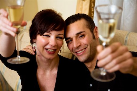 young couple celebrating some occasion and having fun Stock Photo - Budget Royalty-Free & Subscription, Code: 400-04448331