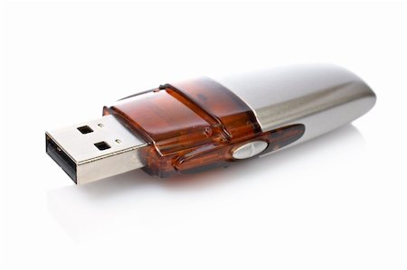simsearch:400-04730368,k - Portable flash usb pen drive memory with shadow reflected on white background. Shallow DOF Photographie de stock - Aubaine LD & Abonnement, Code: 400-04448507