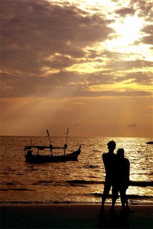 reverie - loving couple on beach at sunset Stock Photo - Budget Royalty-Free & Subscription, Code: 400-04448607