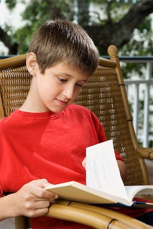 simsearch:400-03923096,k - Caucasian pre-teen boy reading book. Stock Photo - Budget Royalty-Free & Subscription, Code: 400-04448828