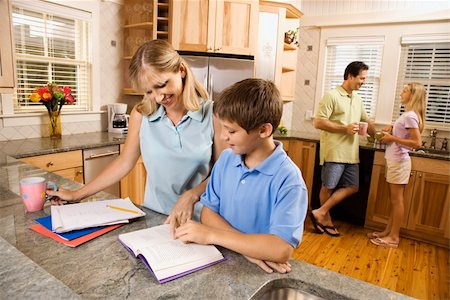 simsearch:400-03923096,k - Caucasian family in kitchen doing homework and chatting. Stock Photo - Budget Royalty-Free & Subscription, Code: 400-04448821