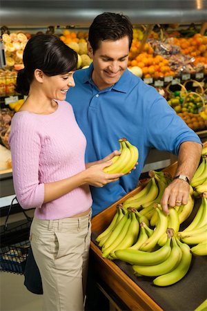 Caucasian mid-adult couple grocery shopping for bananas. Stock Photo - Budget Royalty-Free & Subscription, Code: 400-04448946