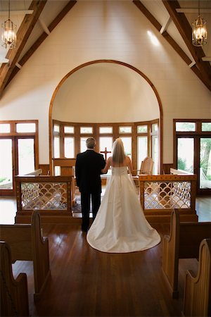 Portrait of bride and groom at alter of a church. Stock Photo - Budget Royalty-Free & Subscription, Code: 400-04449074