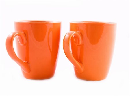 simsearch:400-03971684,k - Coffee mugs in orange on white Foto de stock - Super Valor sin royalties y Suscripción, Código: 400-04449380