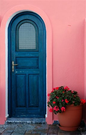 Image shows a blue door with a flower pot next to it, captured on a Greek island. Stock Photo - Budget Royalty-Free & Subscription, Code: 400-04449930