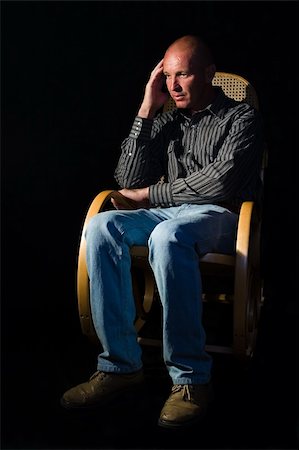 Rocking my life away, everyday thoughts, mid age man in a rocking chair Stock Photo - Budget Royalty-Free & Subscription, Code: 400-04440434