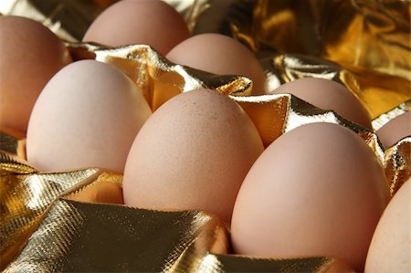 simsearch:400-04639602,k - some fresh eggs in gold background Stock Photo - Budget Royalty-Free & Subscription, Code: 400-04440865