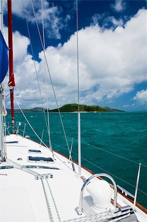 Overlooking the top deck of a sailboat while cruising through the Whitsunday Islands on the Great Barrier Reef in Australia. Photographie de stock - Aubaine LD & Abonnement, Code: 400-04441310