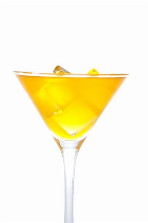 simsearch:400-03957564,k - Detail of glass of fresh orange cocktail with ice cubes reflected on white background Photographie de stock - Aubaine LD & Abonnement, Code: 400-04441367
