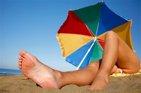 simsearch:400-04912125,k - Low angle view of woman sunbathing on a beach Stock Photo - Budget Royalty-Free & Subscription, Code: 400-04441535
