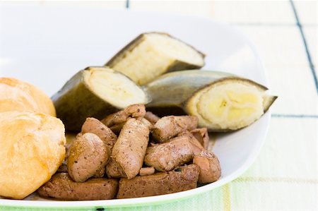 simsearch:400-04440947,k - Caribbean dish of liver, served with fried dumplings and banana. Fotografie stock - Microstock e Abbonamento, Codice: 400-04441735