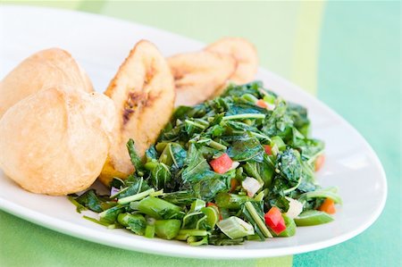 simsearch:400-04475212,k - Speciality caribbean dish of callaloo (spinach) served with fried dumplings Stockbilder - Microstock & Abonnement, Bildnummer: 400-04441736