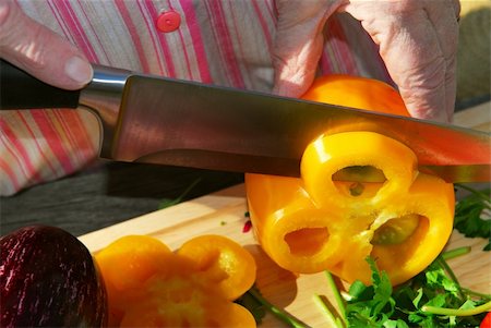 Hands of an elderly woman cutting fresh vegetables Stock Photo - Budget Royalty-Free & Subscription, Code: 400-04442324