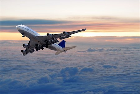 simsearch:400-03933745,k - Big passenger airplane flying above the clouds and sunset Stockbilder - Microstock & Abonnement, Bildnummer: 400-04442321