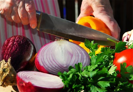 Hands of an elderly woman cutting fresh vegetables Stock Photo - Budget Royalty-Free & Subscription, Code: 400-04442323