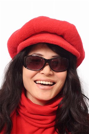 Laughing Asian girl in dark glasses, red cap and scarf, isolated on white background Stock Photo - Budget Royalty-Free & Subscription, Code: 400-04442553