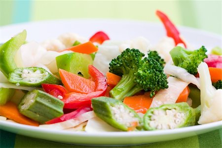 simsearch:400-04475212,k - Vegetable salad greens made from broccoli, okra, cauliflower, red pepper lettuce and carrots. Shallow DOF. Stockbilder - Microstock & Abonnement, Bildnummer: 400-04443284