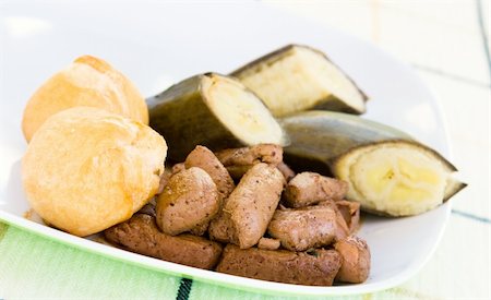 simsearch:400-04440947,k - Caribbean dish of liver, served with fried dumplings and banana. Fotografie stock - Microstock e Abbonamento, Codice: 400-04443289