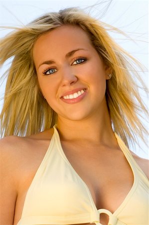 simsearch:400-04310598,k - A stunningly beautiful young blond woman wearing a bikini happily soaks up the summer sunshine Stock Photo - Budget Royalty-Free & Subscription, Code: 400-04443874