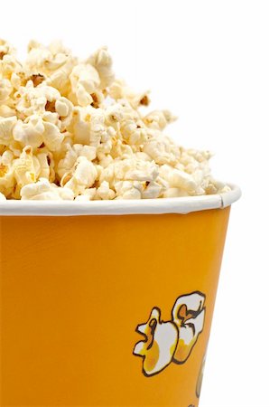 simsearch:400-04913050,k - Detail of popcorn in a bucket over a white background Photographie de stock - Aubaine LD & Abonnement, Code: 400-04454045