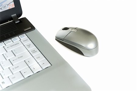 Laptop computer and mouse on white background Stock Photo - Budget Royalty-Free & Subscription, Code: 400-04454139