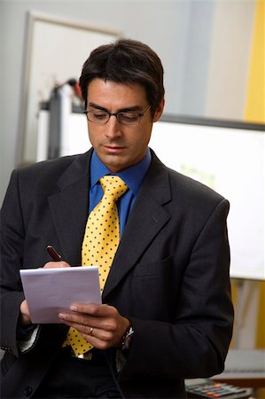 simsearch:400-08159440,k - work place: successful businessman smiling and staring at the camera Stock Photo - Budget Royalty-Free & Subscription, Code: 400-04454240