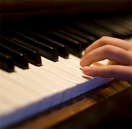 piano clef - close-up of a piano hand and fingers on the keys, shallow dof nice music background Stock Photo - Budget Royalty-Free & Subscription, Code: 400-04454549