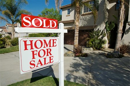 family with sold sign - Sold Home For Sale Sign in front of Beautiful New Home. Stock Photo - Budget Royalty-Free & Subscription, Code: 400-04454857