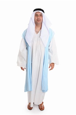Man in ancient clothing reminiscent that worn of biblical times. He is wearing a robe (thobe) and cloak, headdress and leather sandals   Variations are still worn today. Stockbilder - Microstock & Abonnement, Bildnummer: 400-04454889