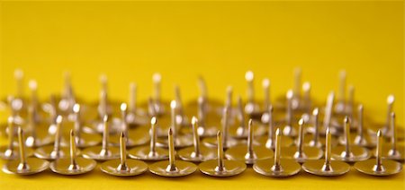 fedotishe (artist) - Thumb tacks nickel plated on a yellow background Stock Photo - Budget Royalty-Free & Subscription, Code: 400-04455167