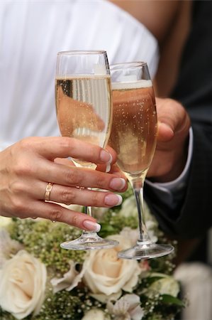 simsearch:400-03929021,k - Glasses of champagne of champagne in a hand of the groom and bride Stock Photo - Budget Royalty-Free & Subscription, Code: 400-04455325