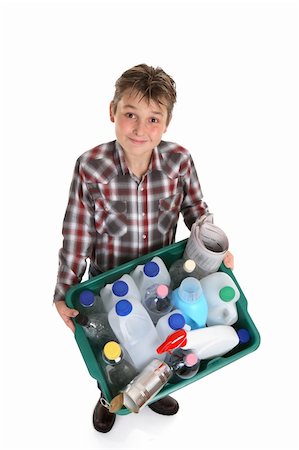 Boy carrying a recycling container full of empty bottles, cans, etc suitable for recycling. Stock Photo - Budget Royalty-Free & Subscription, Code: 400-04455428