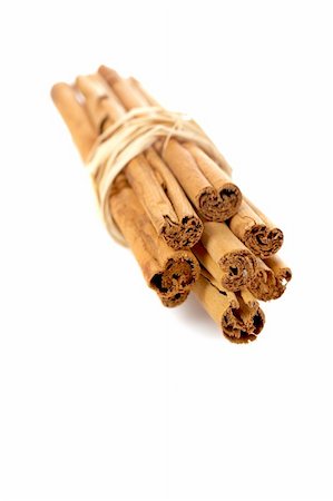 simsearch:400-04791848,k - Sticks of cinnamon joined with string on the white background. Shallow DOF and soft shadow Photographie de stock - Aubaine LD & Abonnement, Code: 400-04455718