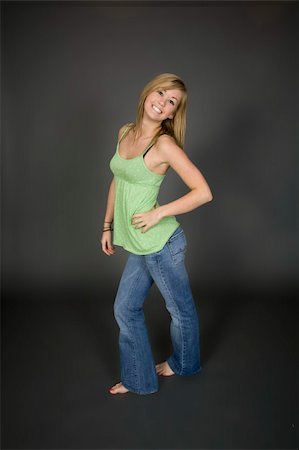 simsearch:400-04960190,k - Teenage girl posing on gray background with some attitude Stock Photo - Budget Royalty-Free & Subscription, Code: 400-04456107