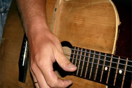 simsearch:400-05352838,k - Closeup of guitar and muscian's hand. Photographie de stock - Aubaine LD & Abonnement, Code: 400-04456635