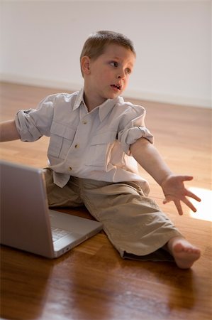 fabthi (artist) - Child trying to learn how to use a pc Stock Photo - Budget Royalty-Free & Subscription, Code: 400-04457079